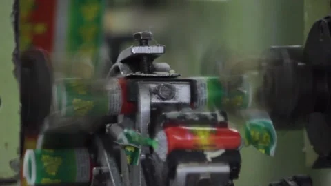 The mechanism of the packaging machine packages the candy bars Stock Footage 128643123