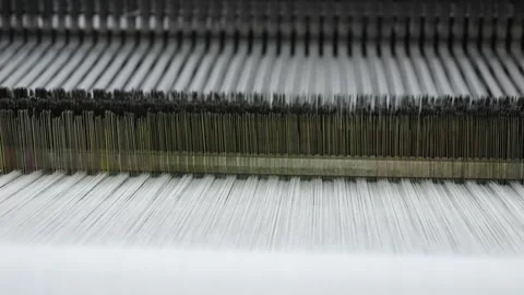 Mechanism of the working loom in operation close-up, weaving, fabric making Stock Footage 272887444