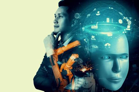 Mechanized industry robot and human worker working together in future factory Stock Photos