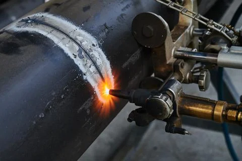 Mechanized, precise cutting of large diameter steel pipe using special equipment Stock Photos