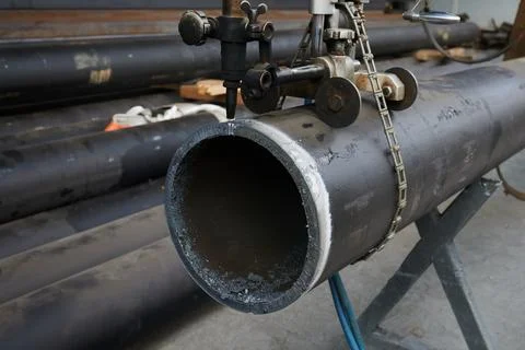 Mechanized, precise cutting of large diameter steel pipe using special equipment Stock Photos