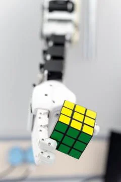 Mechanized robot hand holds the objects drawn to a man's hand shaking hands Stock-Fotos