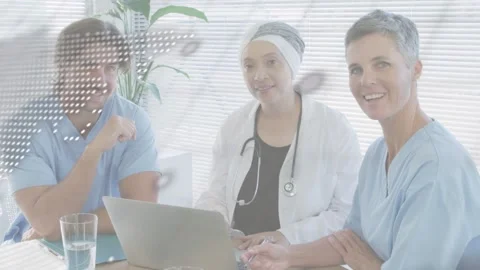 Med team reviewing while lead Dr scrolling laptop, dot map and moving code Stock Footage 333078066