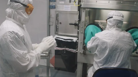 MED two lab techs Vaccine lab testing setup Stock Footage 128737237