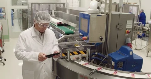 Medecine specialist using digital tablet while taking inventory in Stock Footage 101097865