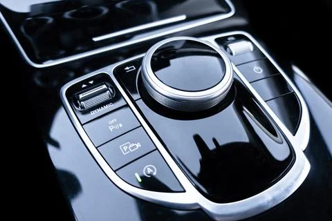 Media and navigation control buttons of a modern car. Car interior details... Stock Photos