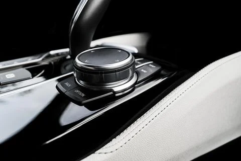Media and navigation control buttons of a Modern car. Car interior details... Stock Photos