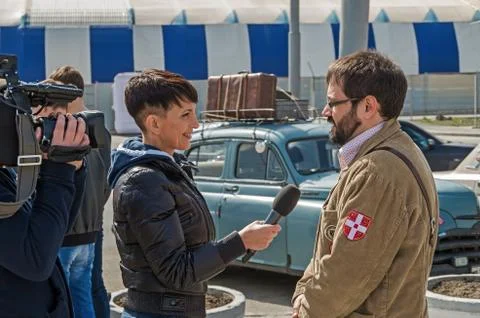 Media correspondent is interviewing Stock Photos