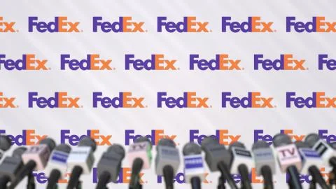 Media event of FEDEX, press wall with logo and microphones, editorial 3D Stock Illustration