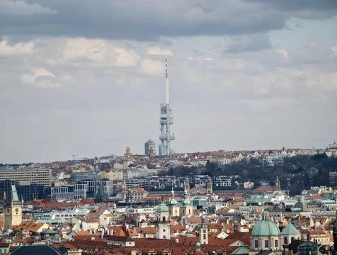Media tower stands against cloudy skyline. Iconic tower shapes urban visual.. Stock Photos