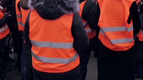 Media in work helmet and reflective vest at plant 库存影片 70939675