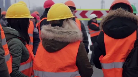 Media in work helmet and reflective vest at plant 库存影片 70940006