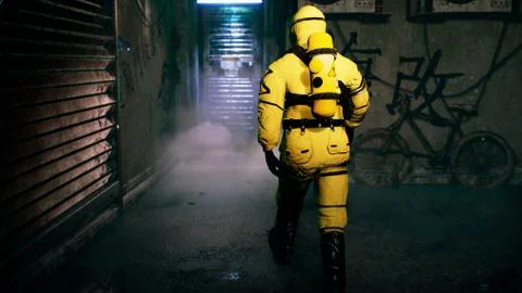 A medic in a bacteriological protection suit returns home. Man in yellow Stock Illustration