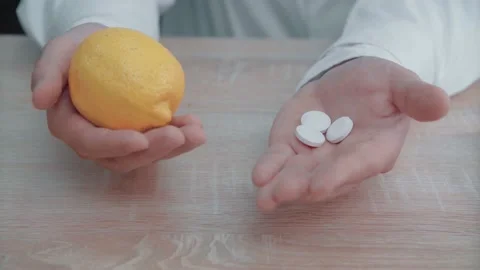 Medic hands hold lemon and pills.Health concept. Stock Footage 154253629