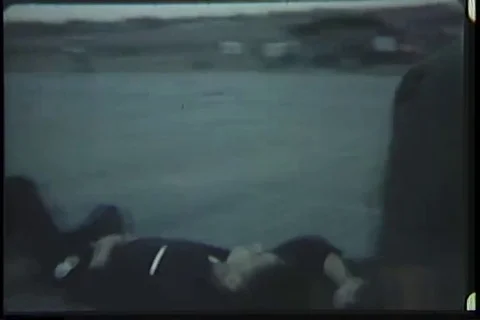 Medic load wounded boy in UH-1D helicopter - 1969 Video stock 99054385