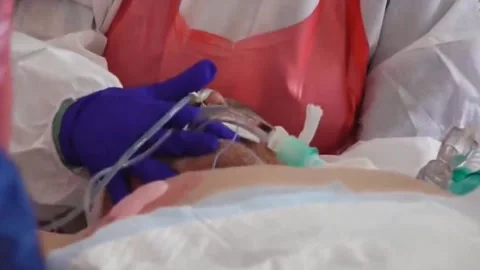 A medic in protective suits is conducting emergency assistance. Pandemic covid-1 Video stock 143162123