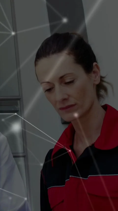 Medic reading doc's blue clipboard, reviewing data, stethoscope visible while Stock Footage 333079568