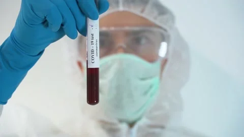 Medic using new vaccine on white hospital background close up. Negative result Stock Footage 131478015