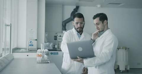 Medical Apprentice showing data on a Laptop to his Manager 스톡 동영상 307911767