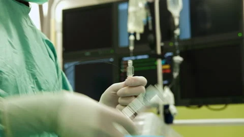 Medical assistant preparing stent placement procedure, coronary heart Stock Footage