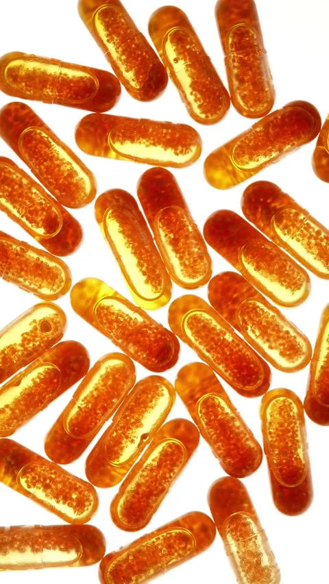 Medical background. Camera movement in a circle. Spilled yellow medicine on a Stock Footage 293779324