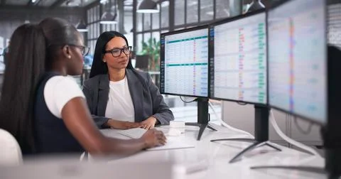 Medical Bill Coder Carefully Types Detailed Patient Codes On Office Computer. Stock Photos