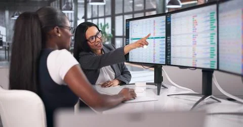 Medical Bill Coder Carefully Typing Detailed Codes On Office Computer. Stock Photos