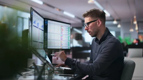 Medical Biller Carefully Reviews Coding Spreadsheets Stock-Footage 342961191