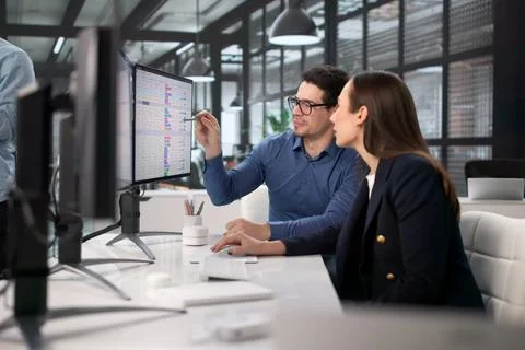 Medical Billing Analysts Using Computers To Code Financial Records Stock Photos