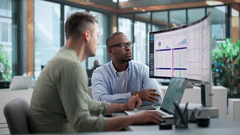 Medical Billing Coder And Analyst Discuss Spreadsheet Data Video stock 345851162