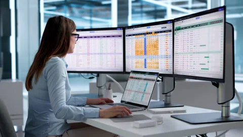 Medical Billing Coder Carefully Analyzes Spreadsheets Using Laptop Computer Stock Footage 347904812