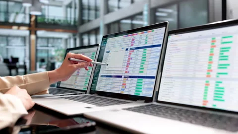 Medical Billing Coder Carefully Reviews Patient Data Stock Footage 338171516
