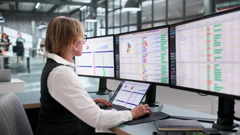 Medical Billing Coder Carefully Reviews Codes On Laptop Stock Footage 340999538