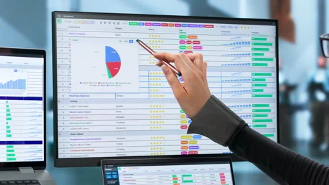 Medical Billing Coder Carefully Reviews Codes While Working Video stock 345329962