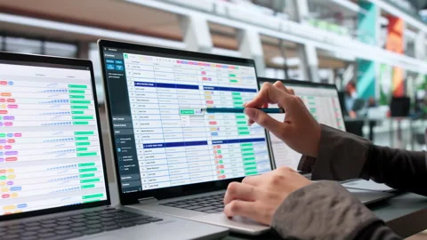 Medical Billing Coder Carefully Reviews Spreadsheets On Laptop Video stock 345859344
