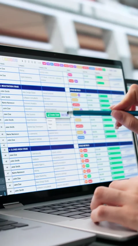 Medical Billing Coder Carefully Reviews Spreadsheets On Laptop Video stock 345861129