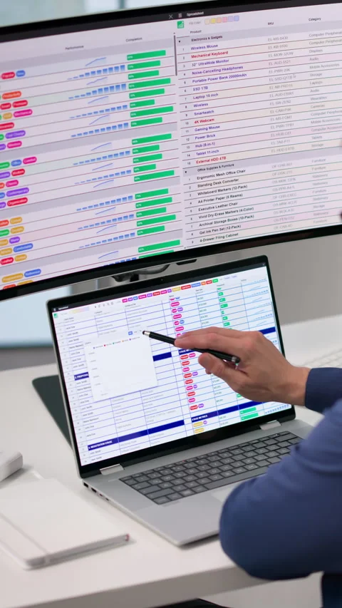 Medical Billing Coder Reviews Spreadsheet Data Using Laptop Stock Footage 347897993