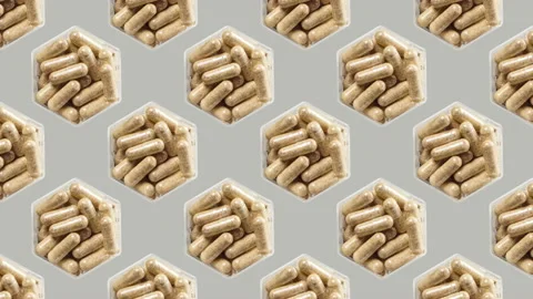 Medical capsules alternating from left to right on gray background Stock Footage 143667059