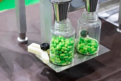 Medical capsules packing process by machine Stock Photos