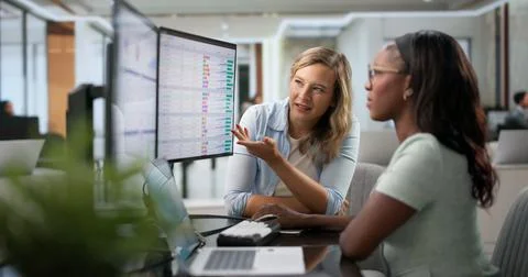 Medical Coder And Billing Analyst Review Healthcare Bills Using Laptop. Stock Photos