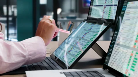 Medical Coder Carefully Analyzes Billing Codes Stock-Footage 345335032