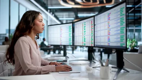 Medical Coder Carefully Inputs Billing Codes On Computer Stock Footage 335881707