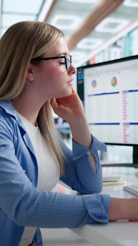 Medical Coder Carefully Reviewing Billing Codes On Computer Screen Stock Footage 344712588