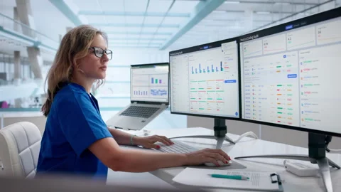 Medical Coder Carefully Reviewing Clinical Billing Data On Laptop Stock Footage 340999059