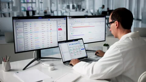 Medical Coder Carefully Reviewing Patient Data On Laptop Stock Footage 335453605