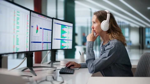 Medical Coder Carefully Reviews Billing Codes On Multiple Computer Screens Stock Footage 336371338