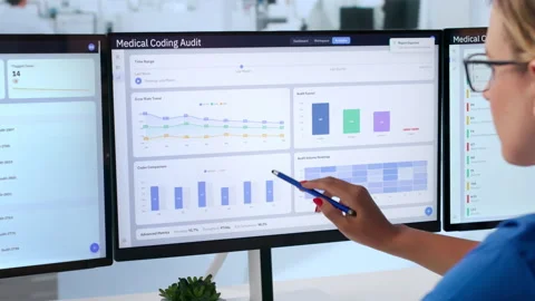 Medical Coder Carefully Reviews Clinical Documents Stock-Footage 342971709