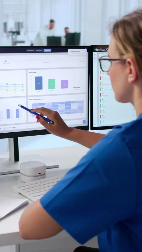 Medical Coder Carefully Reviews Clinical Documents Stock Footage 343881205