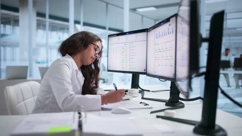 Medical Coder Carefully Reviews Clinical Records Stock-Footage 344717181