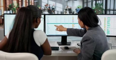 Medical Coder Carefully Typing Billing Codes Into Office Computer Spreadsheet Stockfoto's